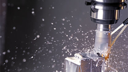 Milling machine in operation machining aluminium