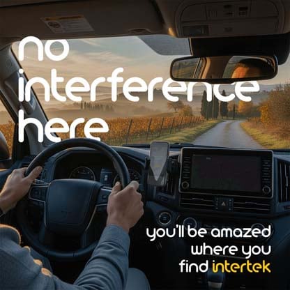 Interior view of car with mounted smartphone driving on a rural road